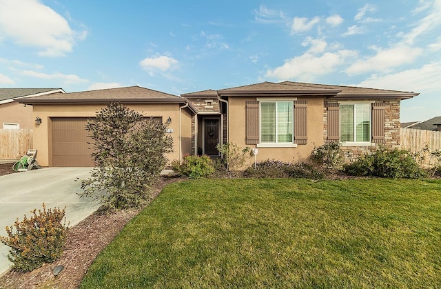 view of front of home featuring a front yard, stone siding, driveway, and an attached garage