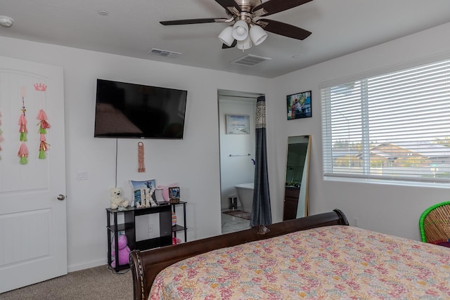 bedroom featuring ceiling fan, visible vents, and light colored carpet