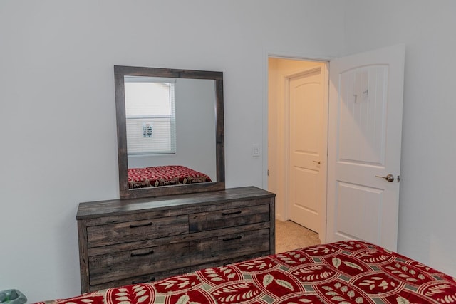 bedroom featuring light colored carpet