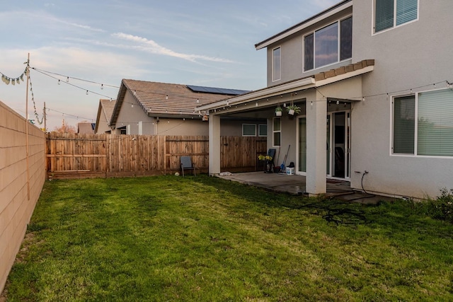 view of yard with a patio and a fenced backyard