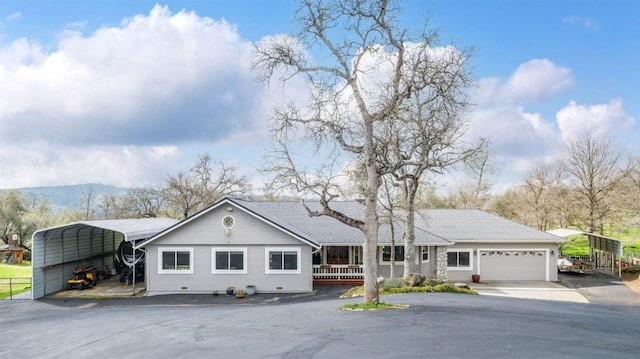 single story home with crawl space, aphalt driveway, a carport, and roof with shingles