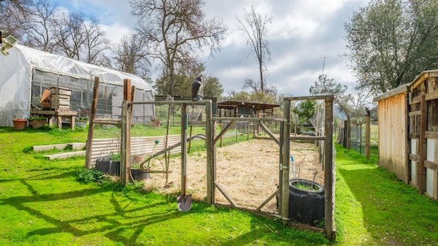 view of jungle gym with an outbuilding, a yard, and cooling unit