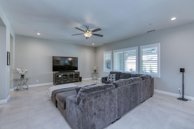 living room featuring baseboards, a ceiling fan, visible vents, and recessed lighting