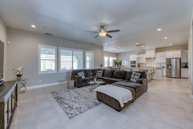 living room featuring recessed lighting, visible vents, ceiling fan, and baseboards