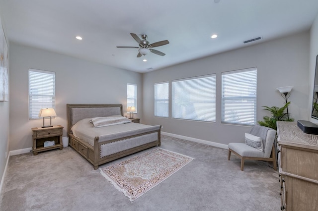 bedroom with light carpet, multiple windows, visible vents, and recessed lighting