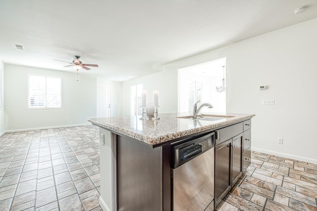 kitchen with visible vents, dishwasher, an island with sink, dark brown cabinets, and a sink