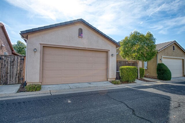 garage featuring fence