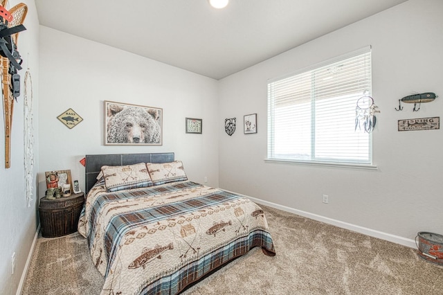 carpeted bedroom with baseboards