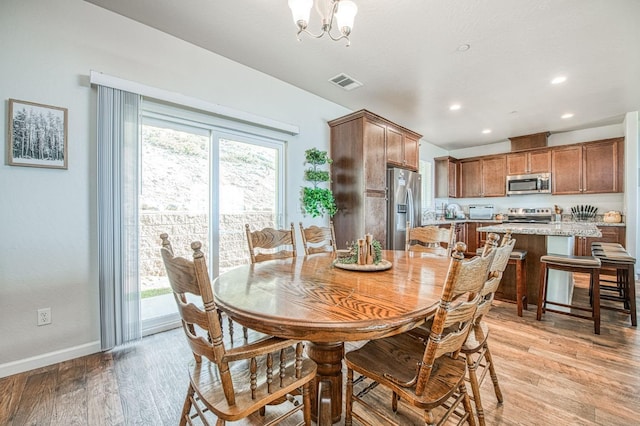 36105 Cressman Rd, Shaver Lake, CA 93664 - dining space featuring light wood finished floors, baseboards, a chandelier, and recessed lighting