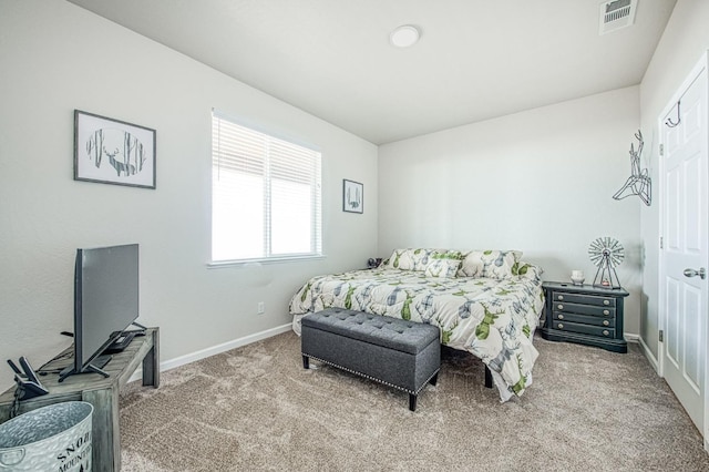 bedroom featuring baseboards, visible vents, and carpet flooring