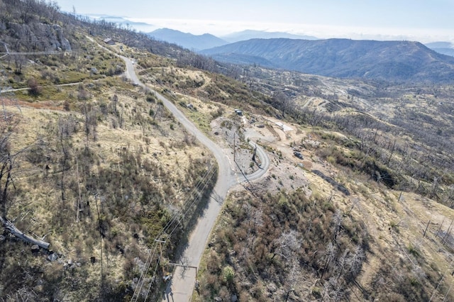 birds eye view of property featuring a mountain view