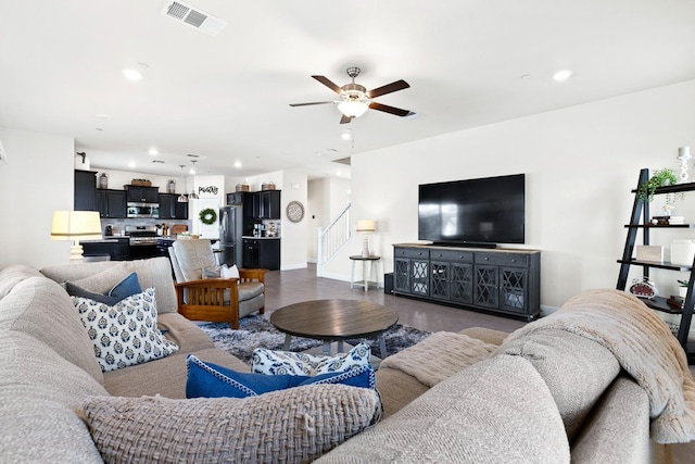 living room with recessed lighting, visible vents, baseboards, a ceiling fan, and stairway