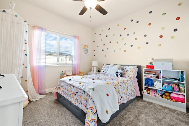 carpeted bedroom with ceiling fan and baseboards