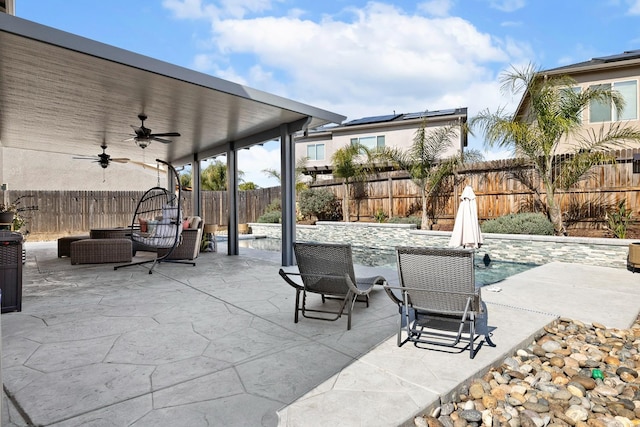 view of patio featuring a fenced backyard and a ceiling fan