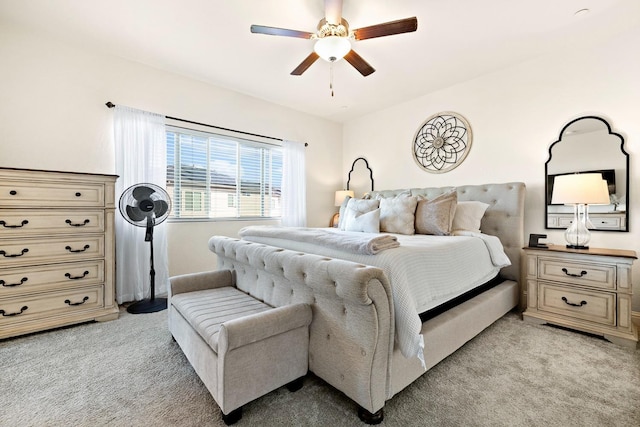 bedroom featuring light carpet and ceiling fan