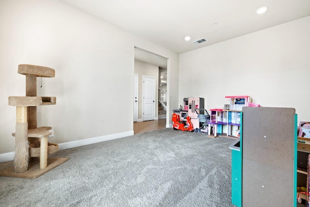 recreation room with carpet floors, recessed lighting, visible vents, and baseboards