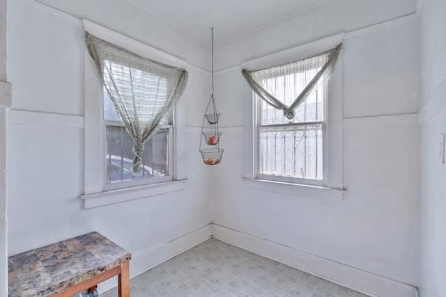 interior space featuring baseboards