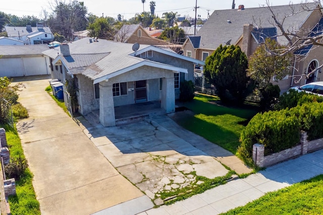 view of front facade with a residential view and a front lawn