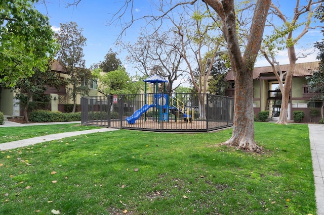 community play area featuring a lawn