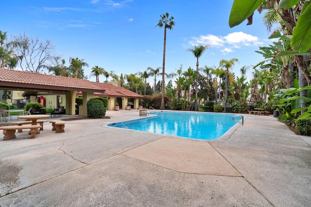 community pool with a patio