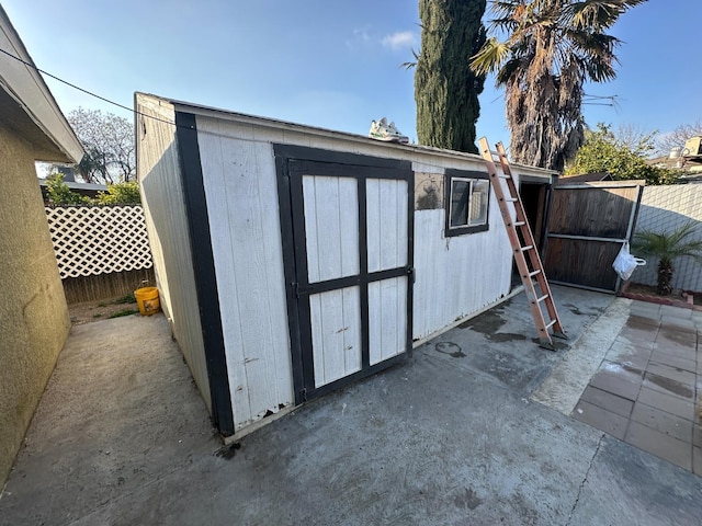 view of shed featuring a fenced backyard