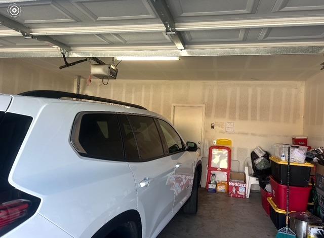 garage featuring a garage door opener