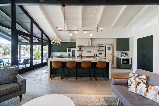2460 W Browning Ave, Fresno, CA 93711 - kitchen with lofted ceiling with beams, a sink, light countertops, backsplash, and stainless steel fridge