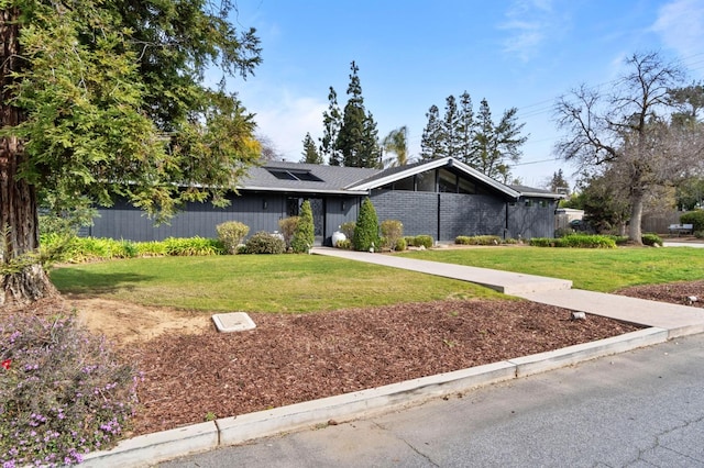2460 W Browning Ave, Fresno, CA 93711 - mid-century inspired home featuring a front lawn and brick siding