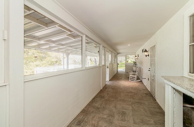 hall with a sunroom and coffered ceiling