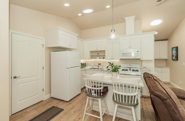 29039 Auberry Rd, Prather, CA 93651 - kitchen featuring white appliances, vaulted ceiling, light wood-style floors, white cabinetry, and light countertops