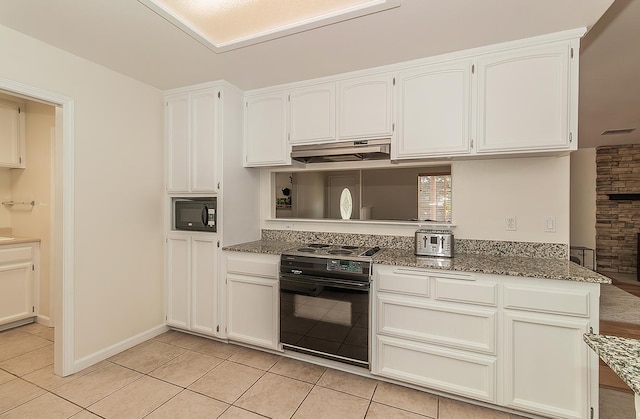 29039 Auberry Rd, Prather, CA 93651 - kitchen with black appliances, under cabinet range hood, light tile patterned flooring, and white cabinetry