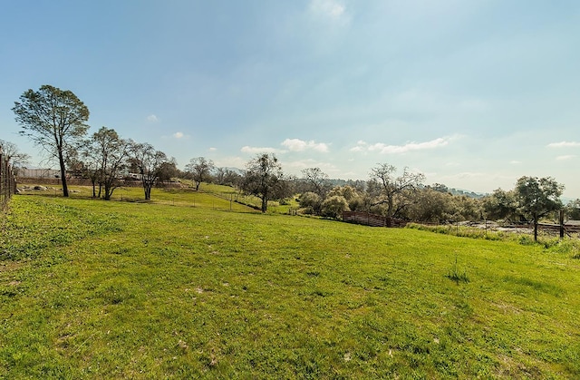 view of yard with a rural view