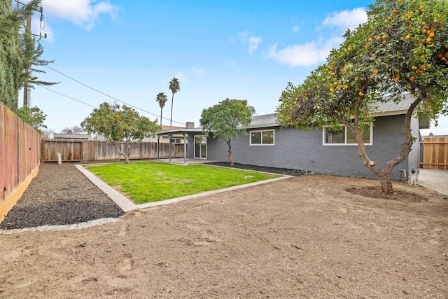 view of yard featuring a fenced backyard and a patio