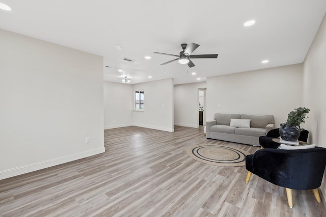 living room with light wood-type flooring, ceiling fan, baseboards, and recessed lighting