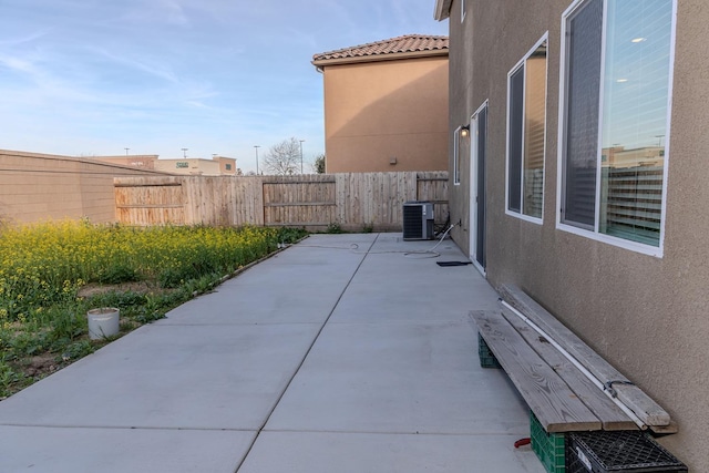 view of patio / terrace featuring a fenced backyard and central AC unit