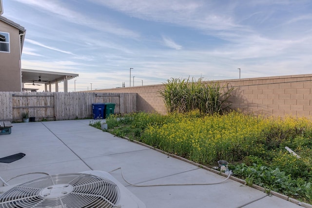 view of patio featuring central AC unit and a fenced backyard