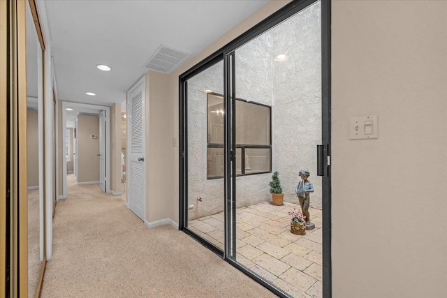 hallway with baseboards, visible vents, carpet flooring, and recessed lighting