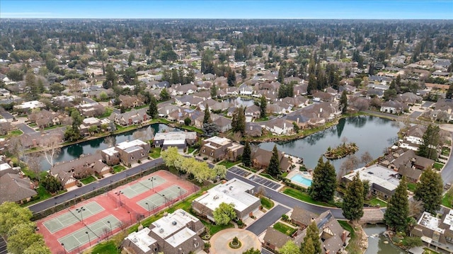 drone / aerial view featuring a water view and a residential view