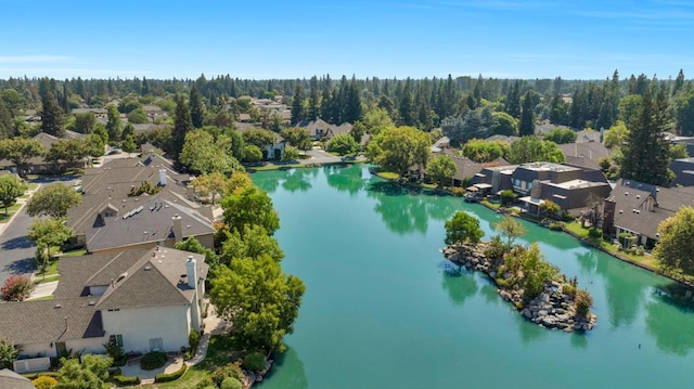 birds eye view of property with a water view and a residential view