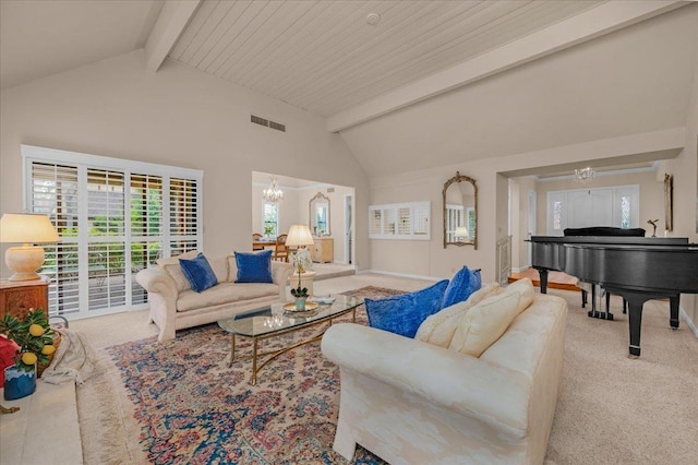 carpeted living room with high vaulted ceiling, visible vents, a notable chandelier, and beamed ceiling