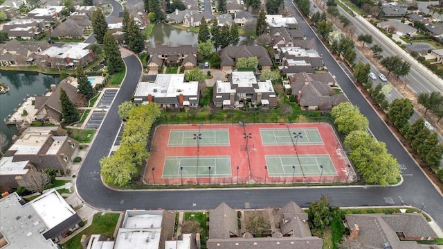 drone / aerial view featuring a water view and a residential view