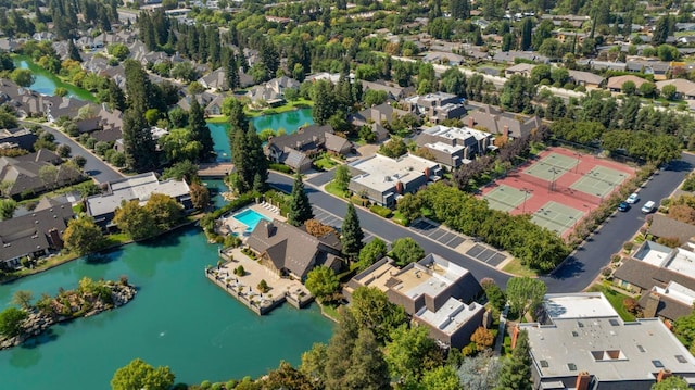 bird's eye view featuring a water view and a residential view