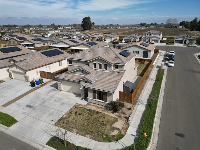 birds eye view of property with a residential view