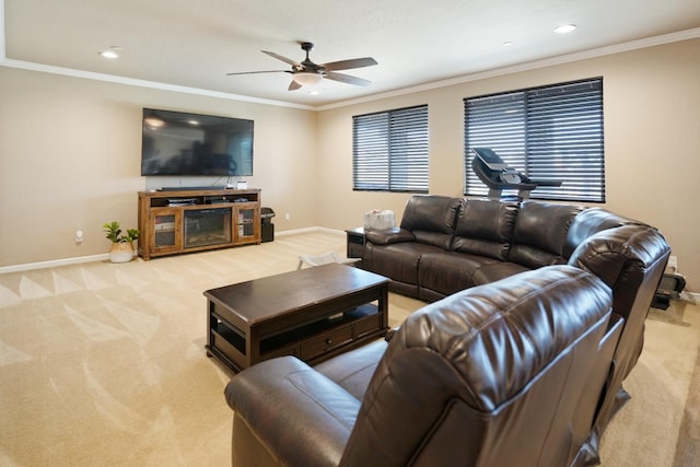 living area featuring baseboards, crown molding, and light colored carpet