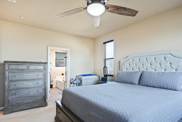 bedroom featuring connected bathroom and ceiling fan