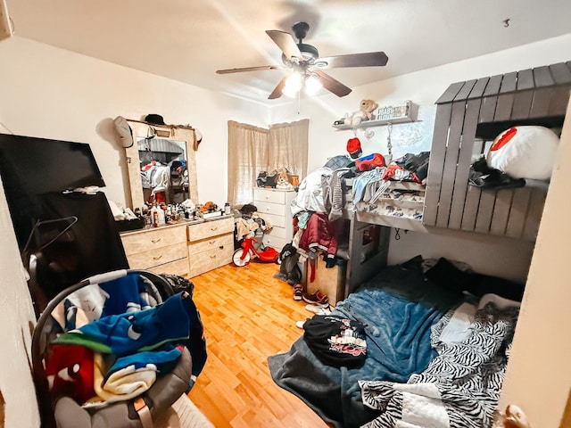 bedroom featuring ceiling fan and wood finished floors