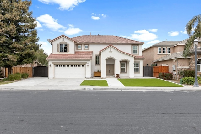 mediterranean / spanish home with concrete driveway, a tile roof, fence, and stucco siding