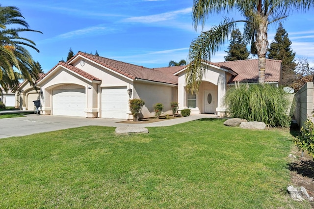 mediterranean / spanish-style house with concrete driveway, a tiled roof, an attached garage, a front lawn, and stucco siding