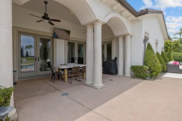 view of patio featuring ceiling fan, outdoor dining area, area for grilling, and french doors