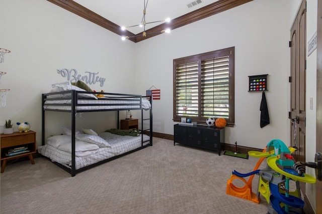 bedroom featuring ornamental molding, carpet flooring, and baseboards